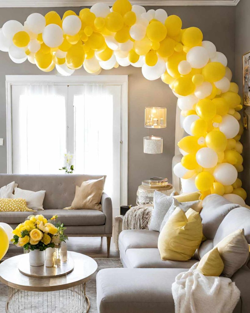yellow and white balloon arch in a cozy living. room